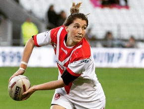 Female rugby player throwing ball